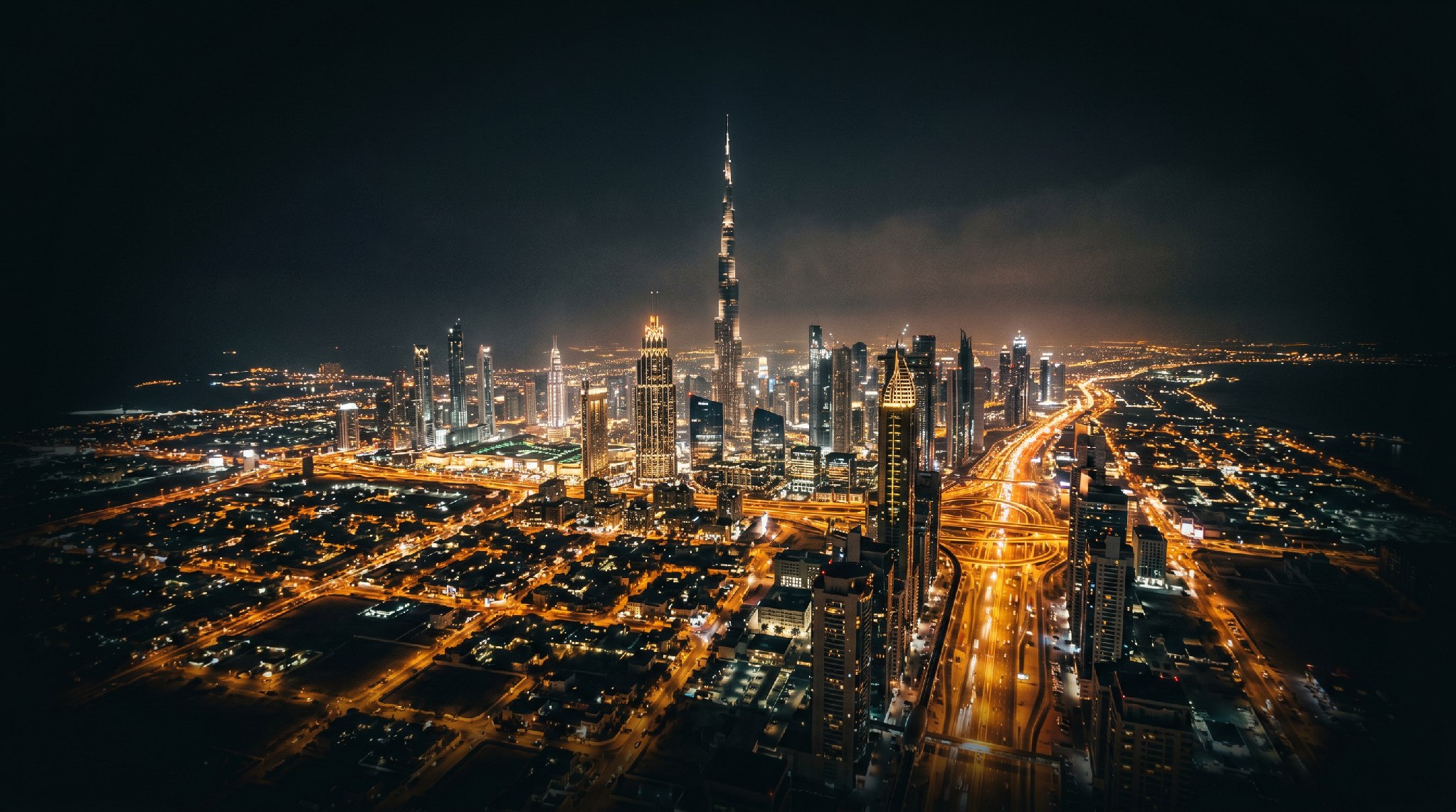 The illuminated Downtown Dubai skyline and Burj Khalifa at night